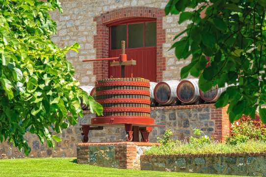 Grape Press And Barrels In Front Of A Cellar Door Of Yalumba Winery In The Barossa Valley - Angaston, SA, Australia