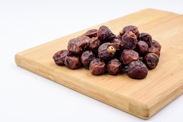 Dried dates on a chopping board
