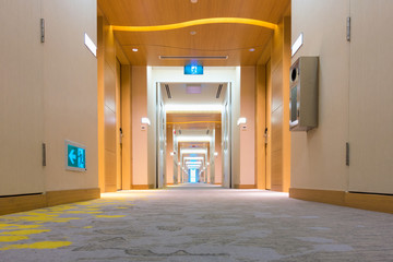 Perspective view of corridor walkway in luxury hotel, Empty corridor in hotel