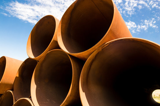 large rusty metal pipes as a background