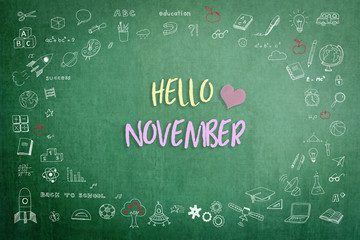 Hello November greeting on green school teacher's chalkboard with creative student's doodle of learning education graphic freehand illustration icon for back to school month concept