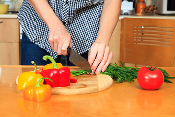 Closeup shot of a woman preparing a salad