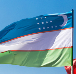 flag of Uzbekistan against the blue sky