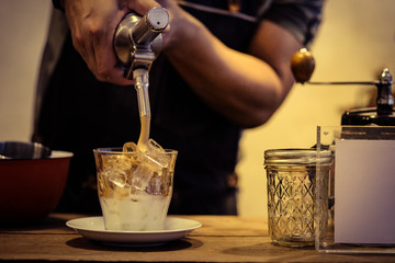 the man making ice latte