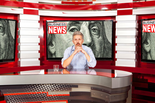Business news. A television anchorman at studio