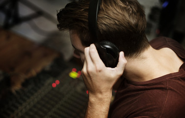 A man listen to headphone checking sound