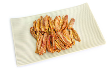 sun dried bananas (honey baked bananas) on plate isolated on white background, Thai preserved food.