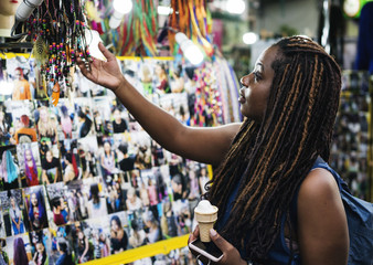 Tourist choosing handmade bracelet for souvenir