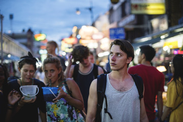 Obraz na płótnie Canvas Group of tourist enjoy bucket drinks in Khao San Road Bangkok Thailand walking street