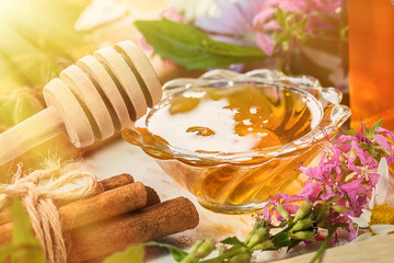 natural organic honey  on a wooden table. toned photo