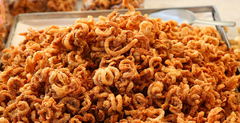 Deep fried pork skin snacks , Thai style food.
