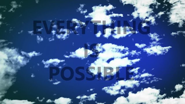 Everything is possible. Words in a sky, with time lapse small clouds. 