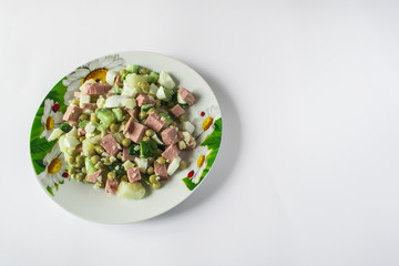 lettuce salad on a light background in a plate