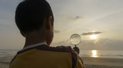 boys playing on the beach, sunrise