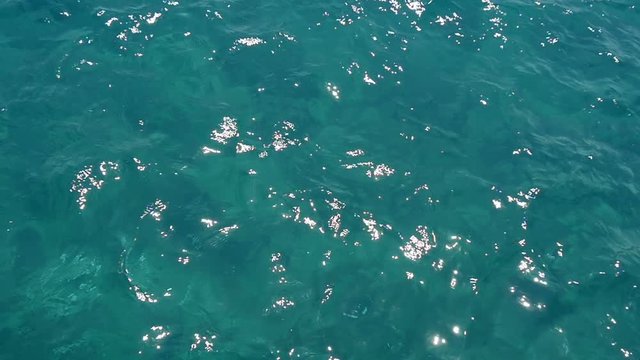 Impressive view of the sparkling and playful turquoise waters of the Aegean Sea on a sunny day in summer. It inspires to feel happy and dreamlike in spite of everything.