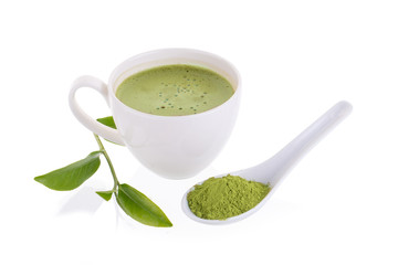 matcha powder in White ceramic spoon and Green tea matcha latte cup isolated on white background