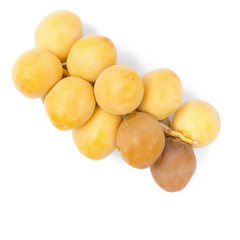 yellow raw dates isolated on white background