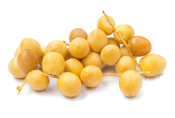 yellow raw dates isolated on white background