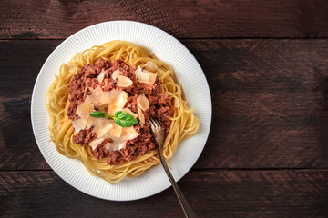 Pasta bolognese on rustic background with copyspace