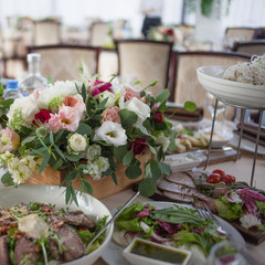 Wedding decor. Flowers in the restaurant, food on the table