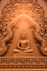 Thai  Buddhaa carving on the wall in the temple, in sun light, from Thailand