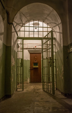 Door lock on rusty metal cell in old prison