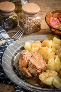 Stewed pork meat served with potatoes
