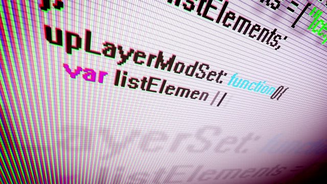 Closeup of the coding information process on a PC screen shown askew with swiftly rushing multicolored dots, lines, digits, letters, equations, placed in a white and violet background 