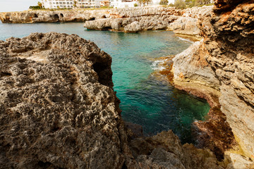 Rocky coast and blue lagoon on the island of Mallorca, Spain