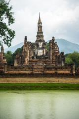 Fototapeta na wymiar Old and ancient Buddha Image in Sukhothai historical park