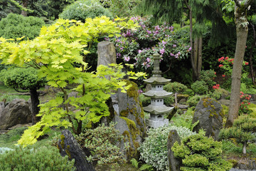 Japanese garden with stone pagoda in summer