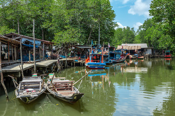 Old wooden boat in the fishing village south-east Asia