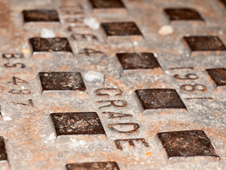 Close up metal grate texture pattern outside at night with flash on the floor background