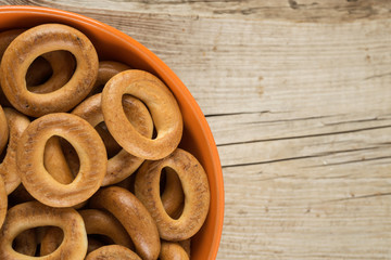 Bagels in a bowl on an wooden table