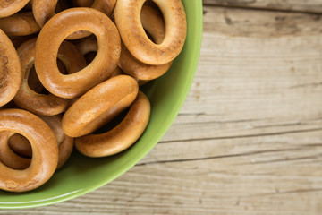 Bagels in a bowl on an wooden table