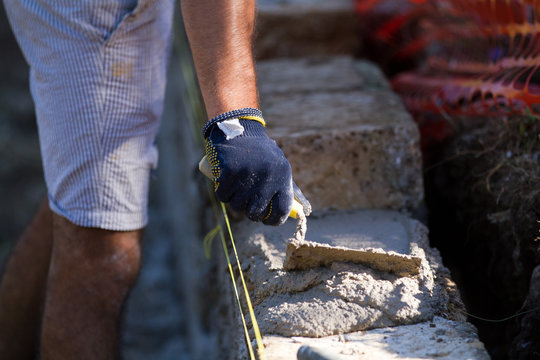 bricklayer making a new wall