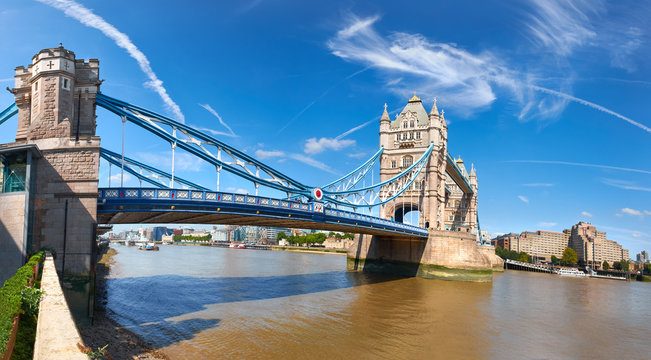 Panoramic image of Tower Bridge in London on a bright sunny day
