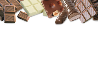Different varieties of chocolate. White chocolate with hazelnuts and cranberries, milk and dark chocolate with hazelnuts