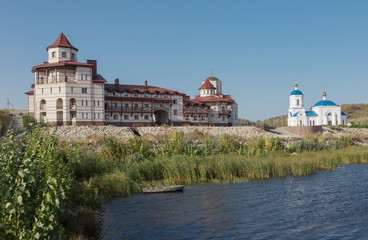 Fototapeta na wymiar Orthodox Church on the shore of river