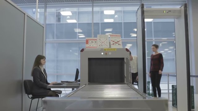 The Couple At The Security Checkpoint In The Airport