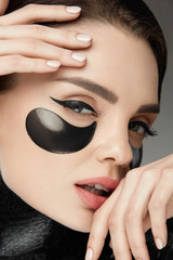 Fashion And Beauty. Female Face With Mask And Patches Under Eyes
