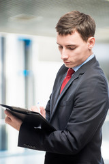 Fototapeta premium Vertical portrait of a director with important documents