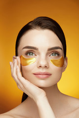 Eye Skin Care Patches. Beautiful Smiling Girl With Mask On Face