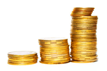 Stacks of golden coins isolated on a white background