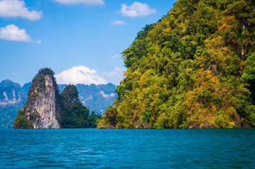 Naklejka na ściany i meble Beautiful mountains lake river sky and natural attractions in Ratchaprapha Dam at Khao Sok National Park, Surat Thani Province, Thailand