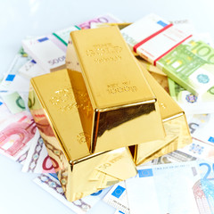 Gold bar and euro money. Financial concept