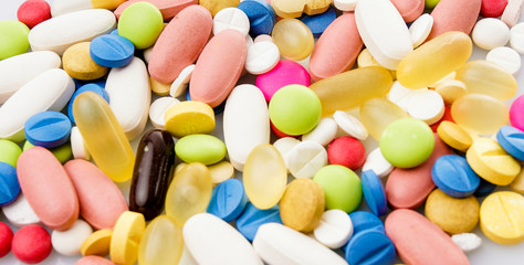 Colorful pills. Medical or vitamin pills. Colorful medicine pills as texture. Pill pattern background