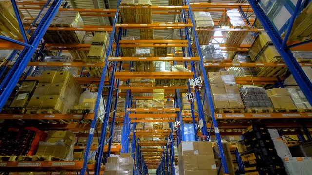 Cardboard boxes inside a storage warehouse. 4K.