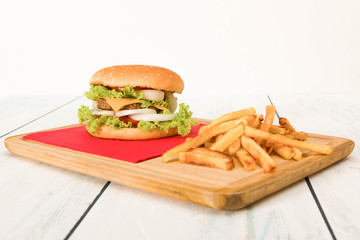 hamburger and french-fries on wooden table