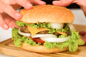 holding a burger